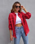 Women wearing a stylish ripped denim jacket for women in red, paired with a crop top and jeans, perfect for autumn and spring fashion.